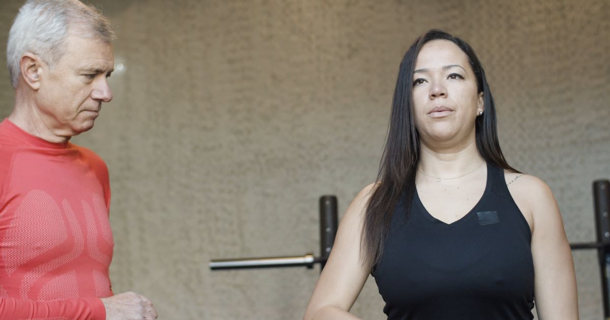 A personal trainer demonstrating a kettlebell lift